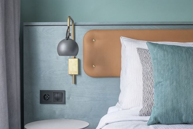 Hypo-allergenic bedding, desk, laptop workspace, blackout drapes
