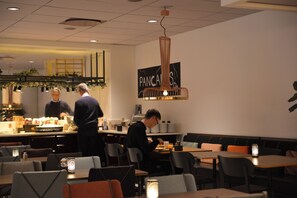Enjoy a meal at this cozy eatery, where friendly servers attend to guests at the counter and in the dining area.
