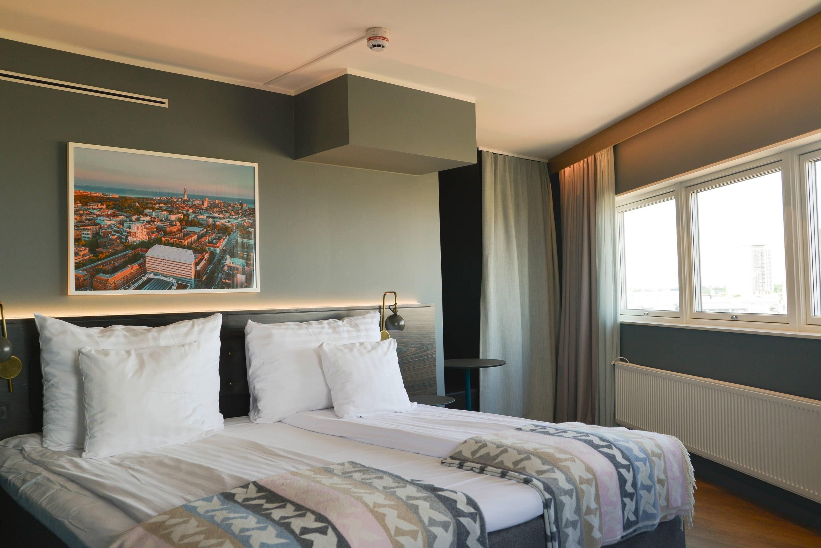 hypo-allergenic bedding, desk, laptop workspace, blackout curtains