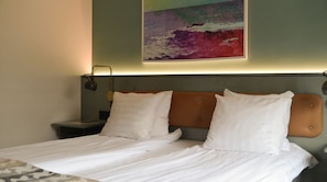 Hypo-allergenic bedding, desk, laptop workspace, blackout curtains