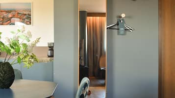 Hypo-allergenic bedding, desk, laptop workspace, blackout drapes
