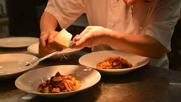 A person serving food on plates.