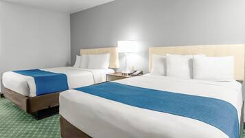 Premium bedding, desk, laptop workspace, blackout curtains