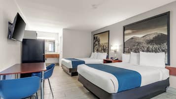 Premium bedding, desk, laptop workspace, blackout curtains