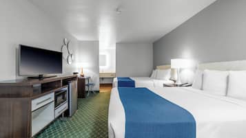 Premium bedding, desk, laptop workspace, blackout curtains