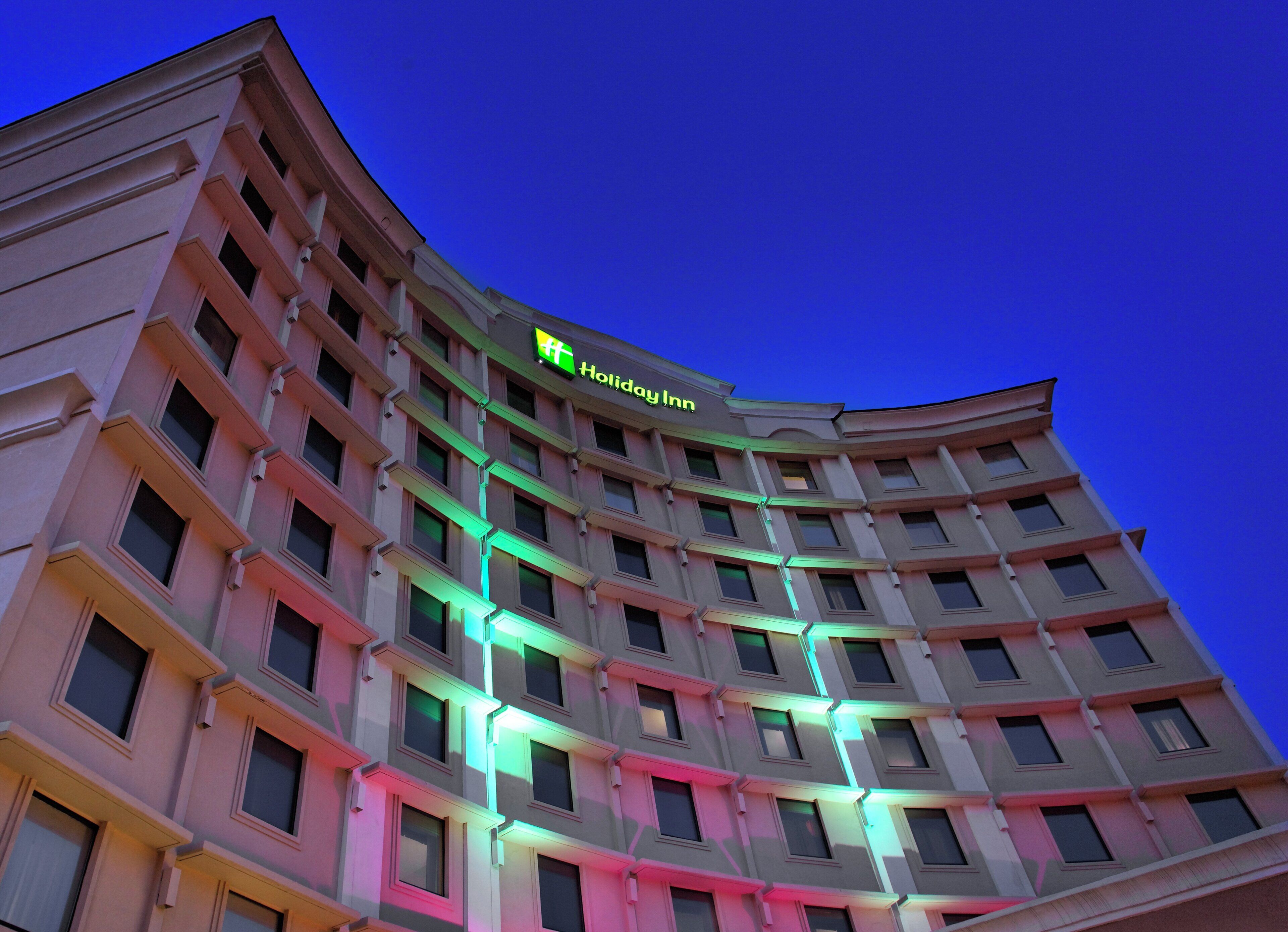 A multi-story hotel building with a prominent Holiday Inn sign.