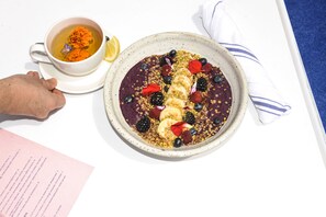 A plate of food with a cup of tea and a napkin. - The Standard Hollywood (West Hollywood)