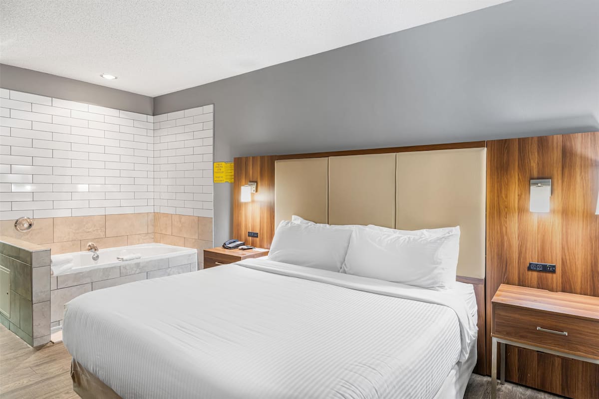 Suite, 1 King Bed, Non Smoking, Jetted Tub | Desk, laptop workspace, iron/ironing board, free WiFi