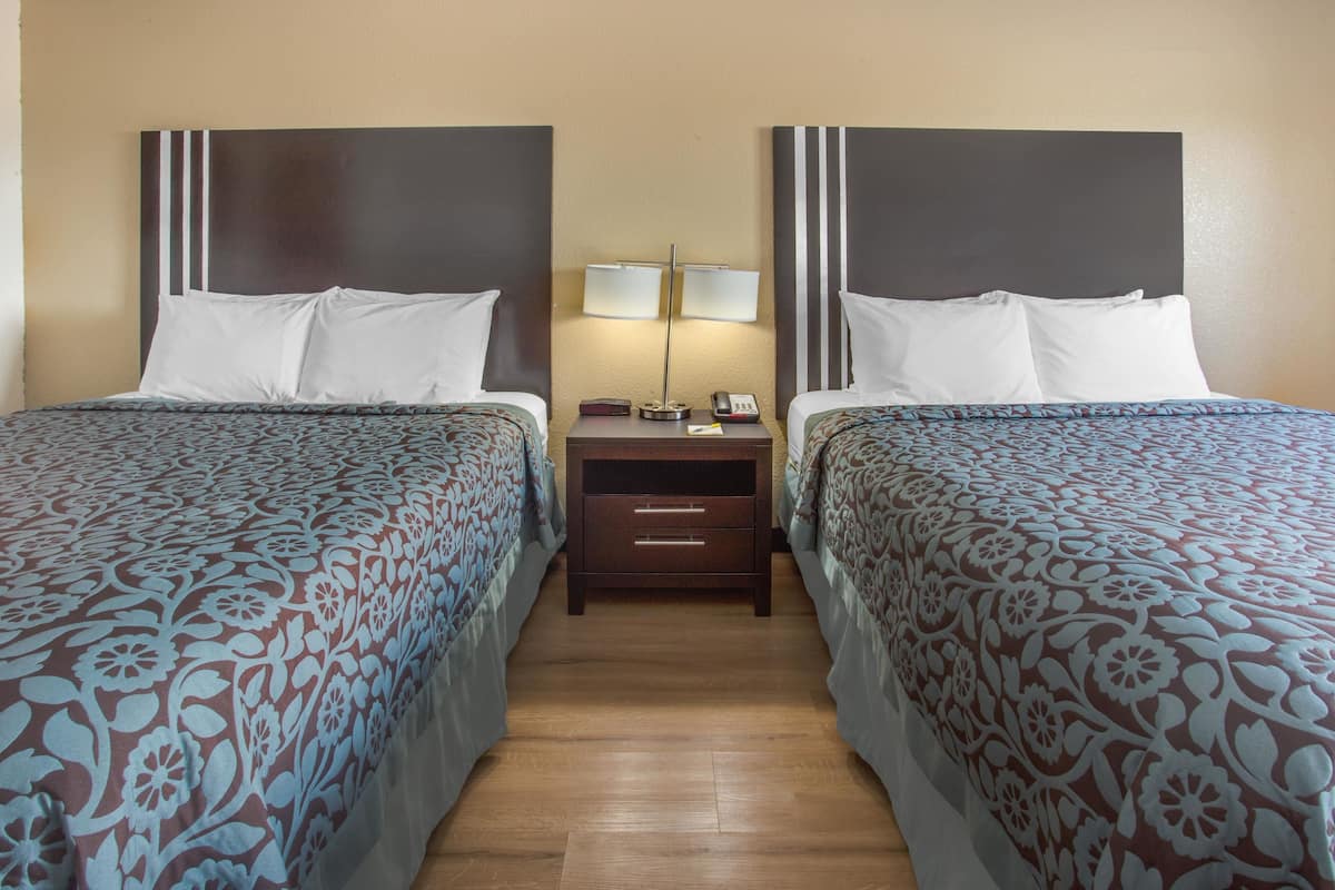 Room, 2 Queen Beds, Non Smoking | Desk, blackout drapes, iron/ironing board, free cribs/infant beds