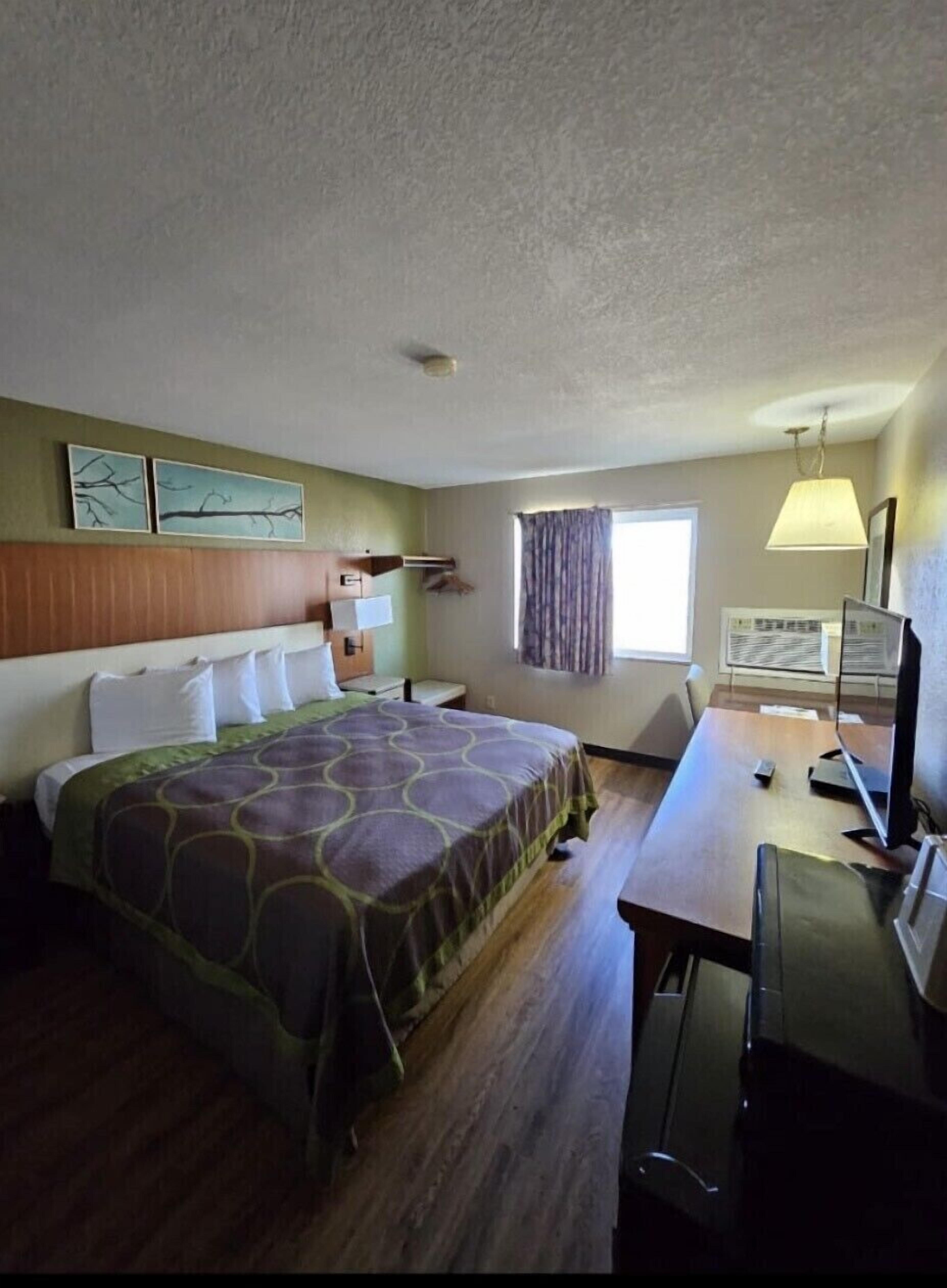 Standard Room, 1 King Bed | Individually furnished, desk, free cribs/infant beds, free WiFi