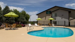 Seasonal outdoor pool, open 9:00 AM to 10:00 PM, sun loungers