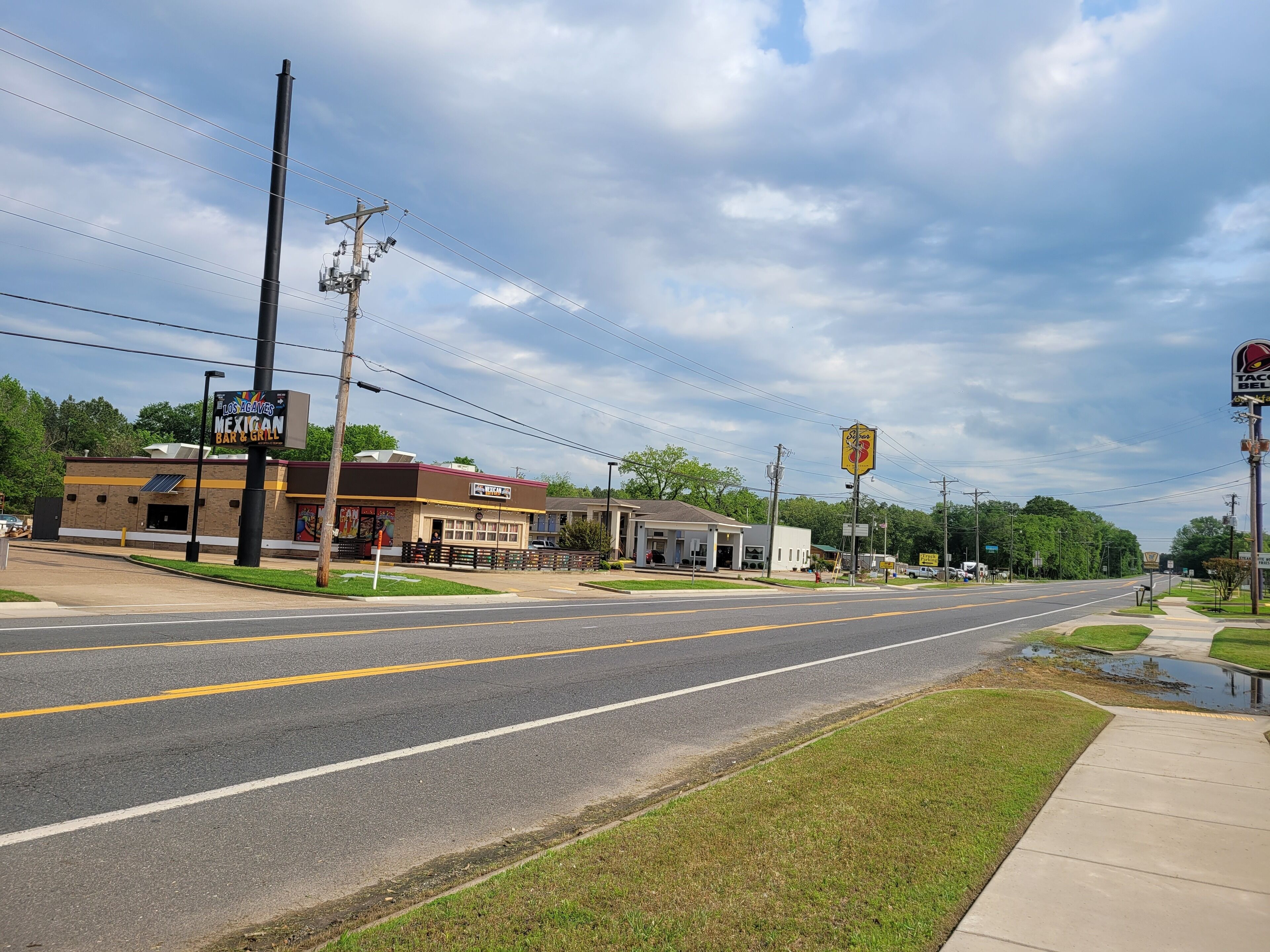 A street view with a Mexican restaurant, a Taco Bell, and a gas station.