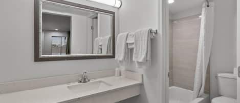 Bathtub, deep soaking tub, towels