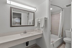Bathtub, deep soaking tub, towels