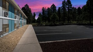 A building with a row of windows and a parking lot. - SureStay Hotel by Best Western Williams - Grand Canyon (Williams)