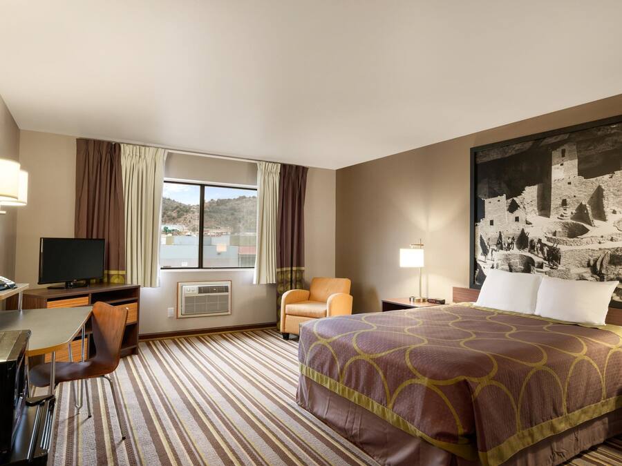 Desk, laptop workspace, blackout curtains, iron/ironing board