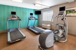 A fitness room with treadmills, an elliptical, and a stationary bike. - Holiday Inn Express & Suites Wheat Ridge-Denver West by IHG (Wheat Ridge)