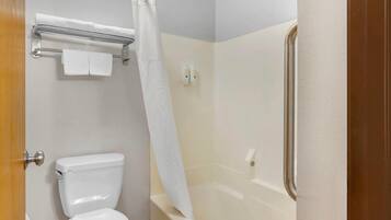 A bathroom with a toilet, a shower curtain, and a towel rack.