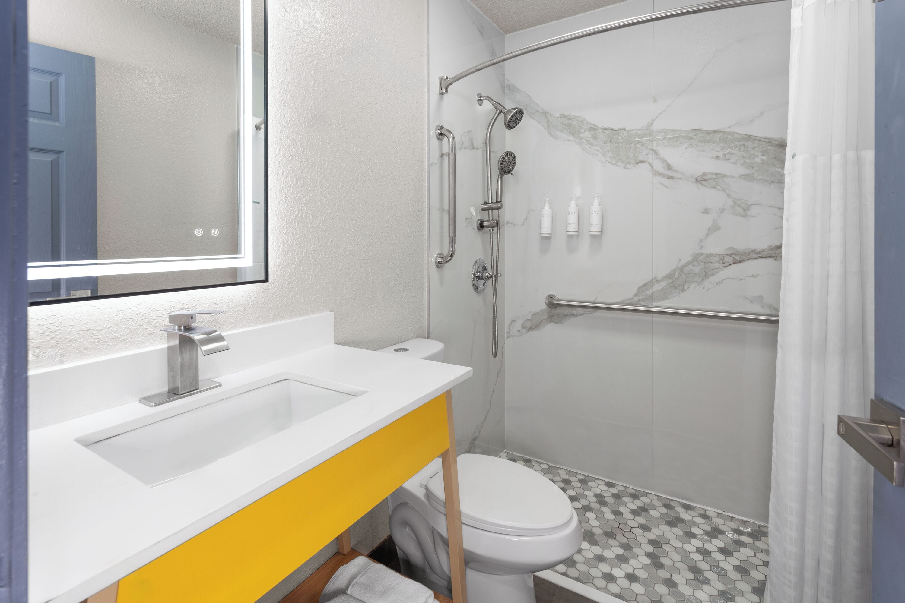 Room, 1 Queen Bed, Mobility Accessible, Non Smoking (Roll-in Shower) | Bathroom | Hair dryer, towels