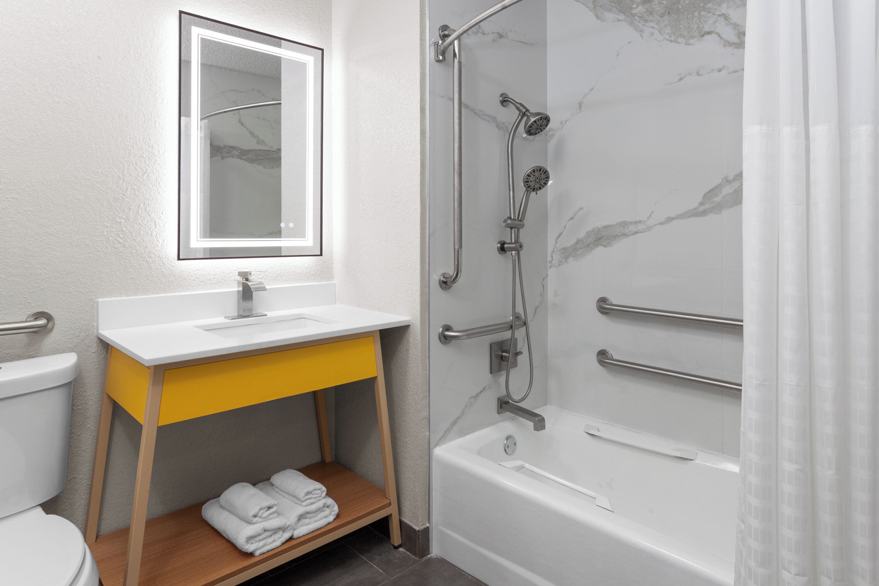 Room, 1 Queen Bed, Mobility Accessible, Non Smoking (Bathtub W/grab Bars) | Bathroom | Hair dryer, towels