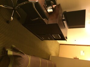 Desk, laptop workspace, blackout drapes, travel crib