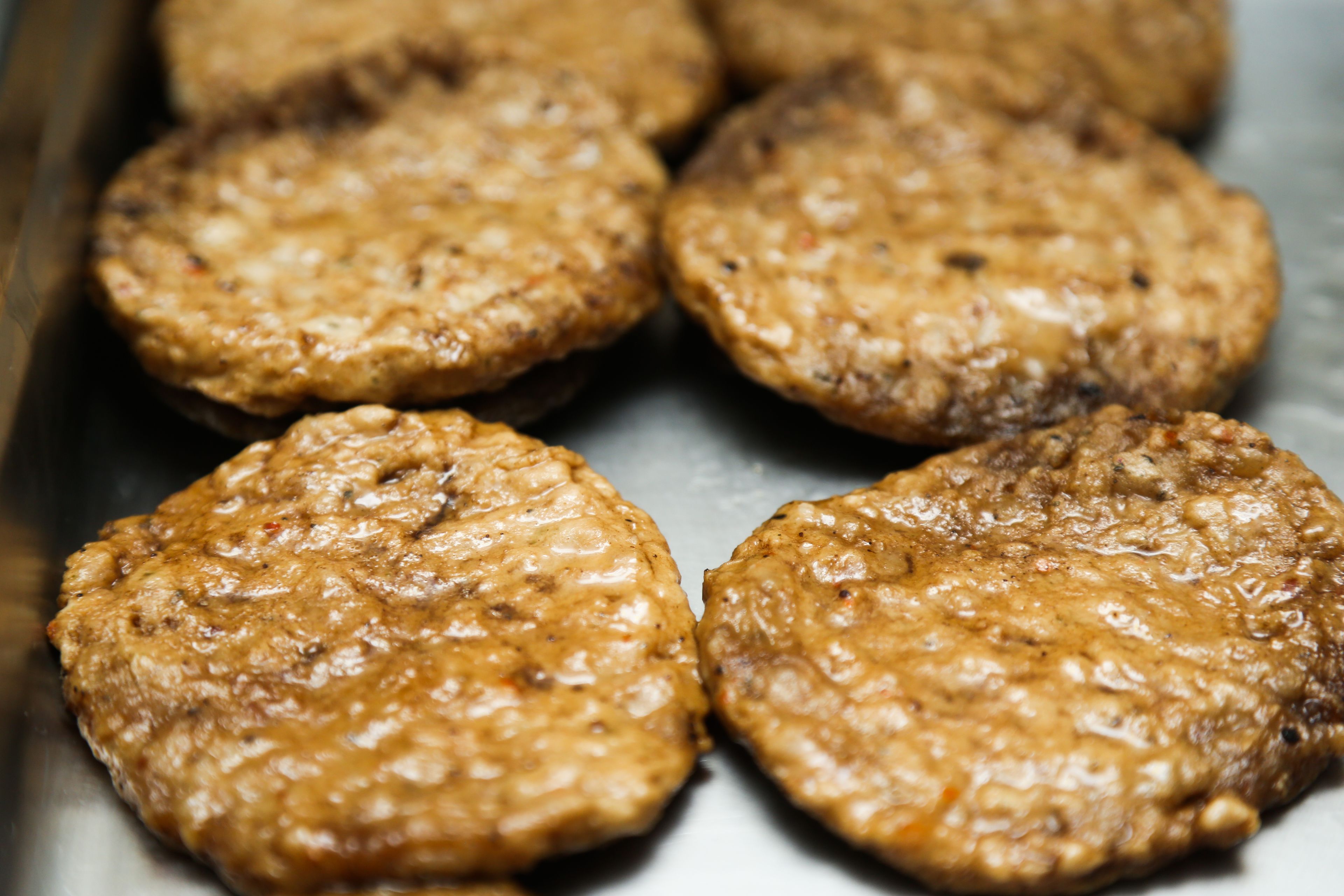 A tray of cooked patties.