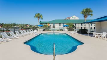 Seasonal outdoor pool, pool loungers