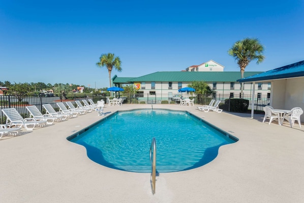 Seasonal outdoor pool, pool loungers