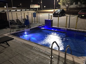 Outdoor pool, open 10 AM to 10 PM, pool loungers