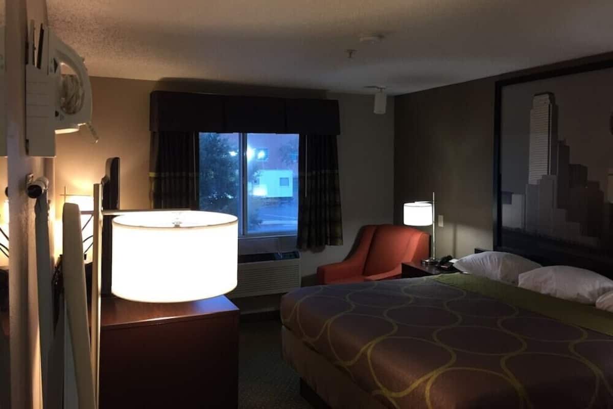 Desk, laptop workspace, blackout drapes, iron/ironing board