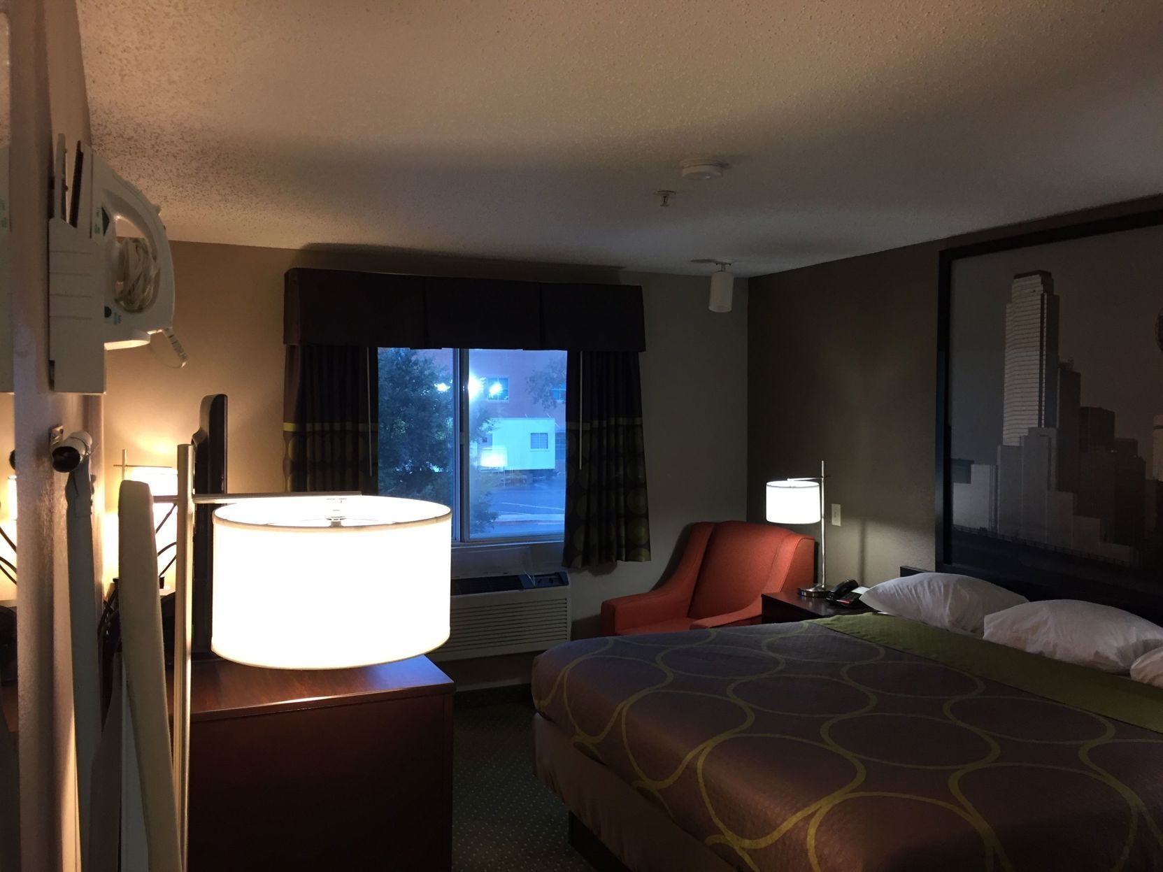 Desk, laptop workspace, blackout drapes, iron/ironing board