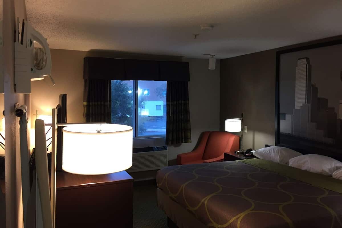 Desk, laptop workspace, blackout curtains, iron/ironing board