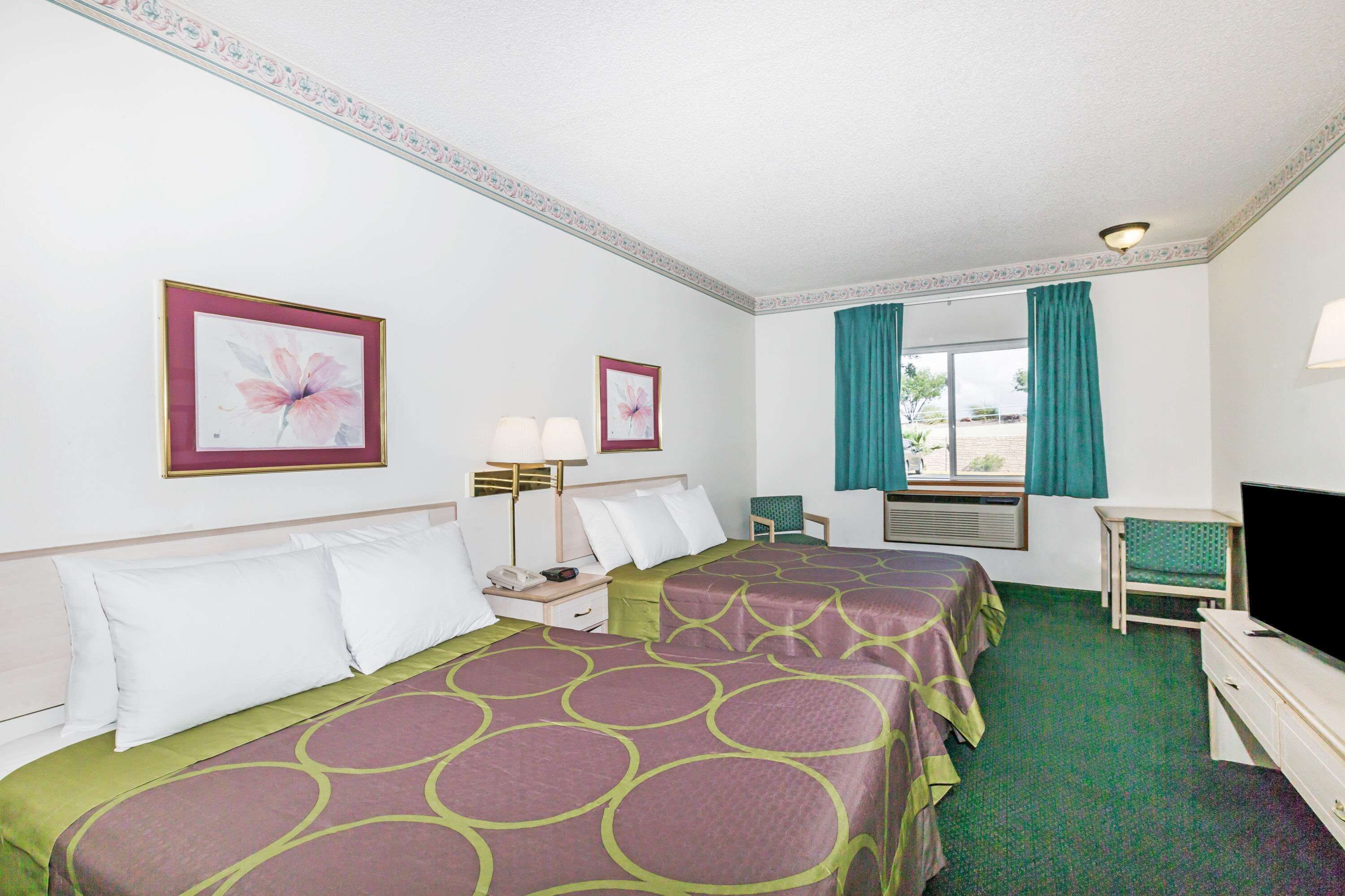 Laptop workspace, blackout drapes, iron/ironing board, rollaway beds