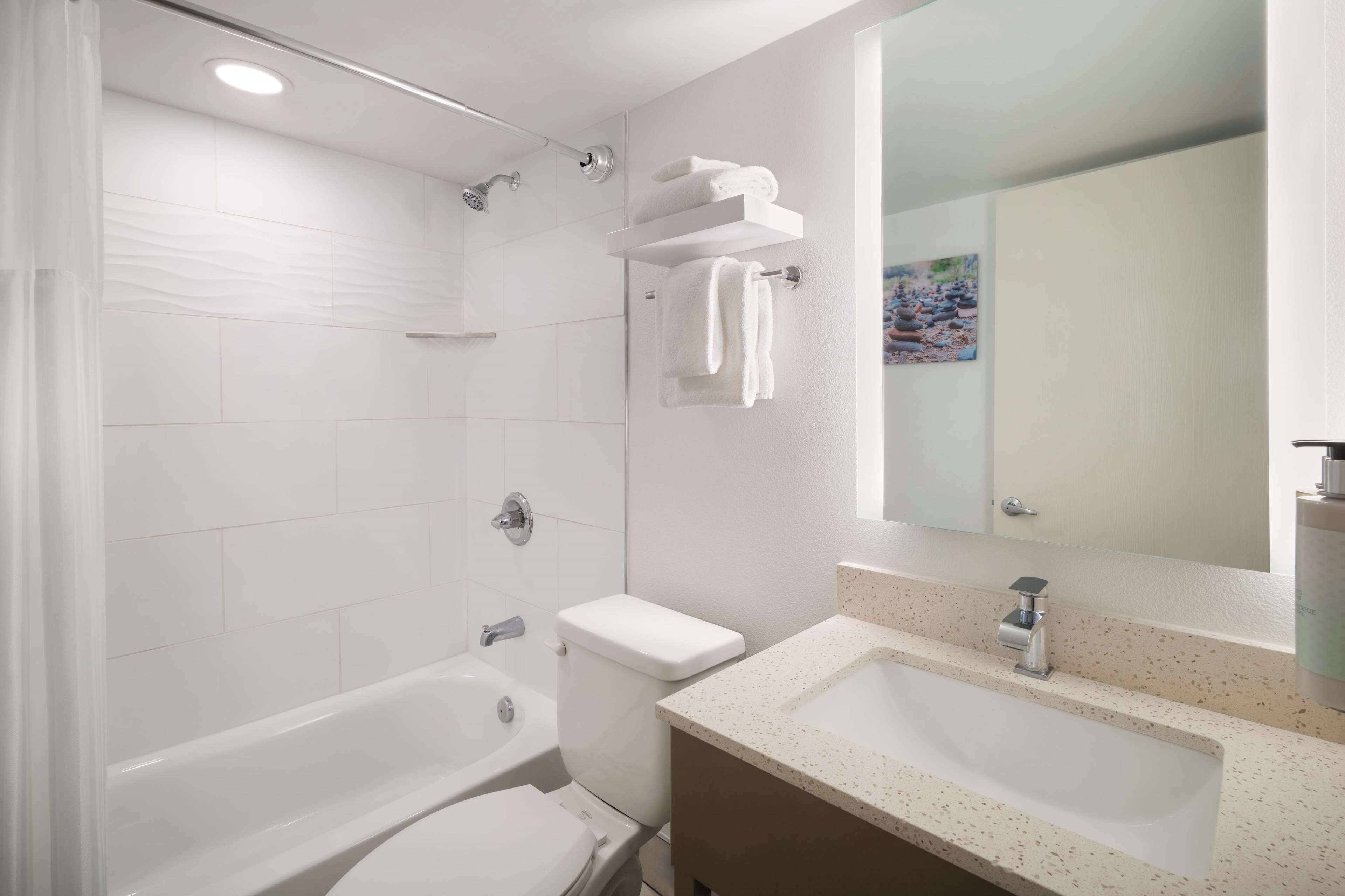 combined shower/bathtub, free toiletries, hair dryer, towels