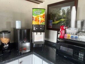 Enjoy a fully equipped kitchen with a coffee machine, microwave, and water dispenser.