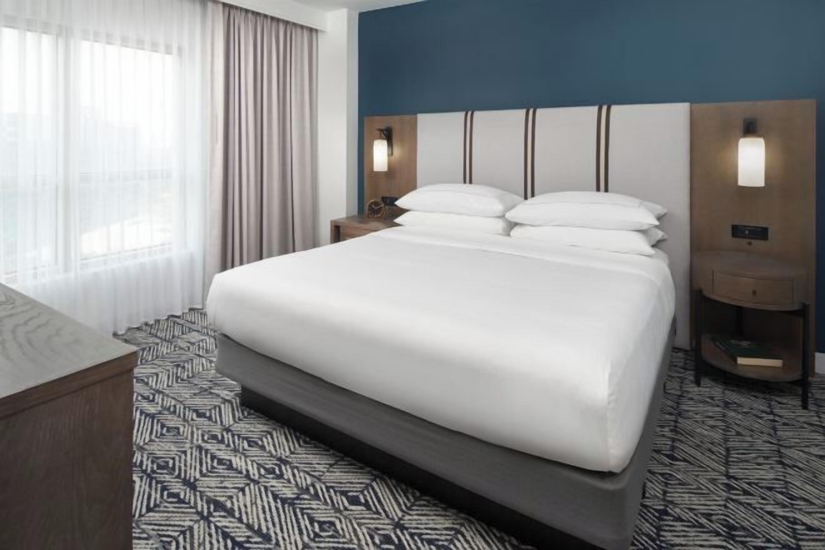 Premium bedding, down comforters, pillowtop beds, in-room safe