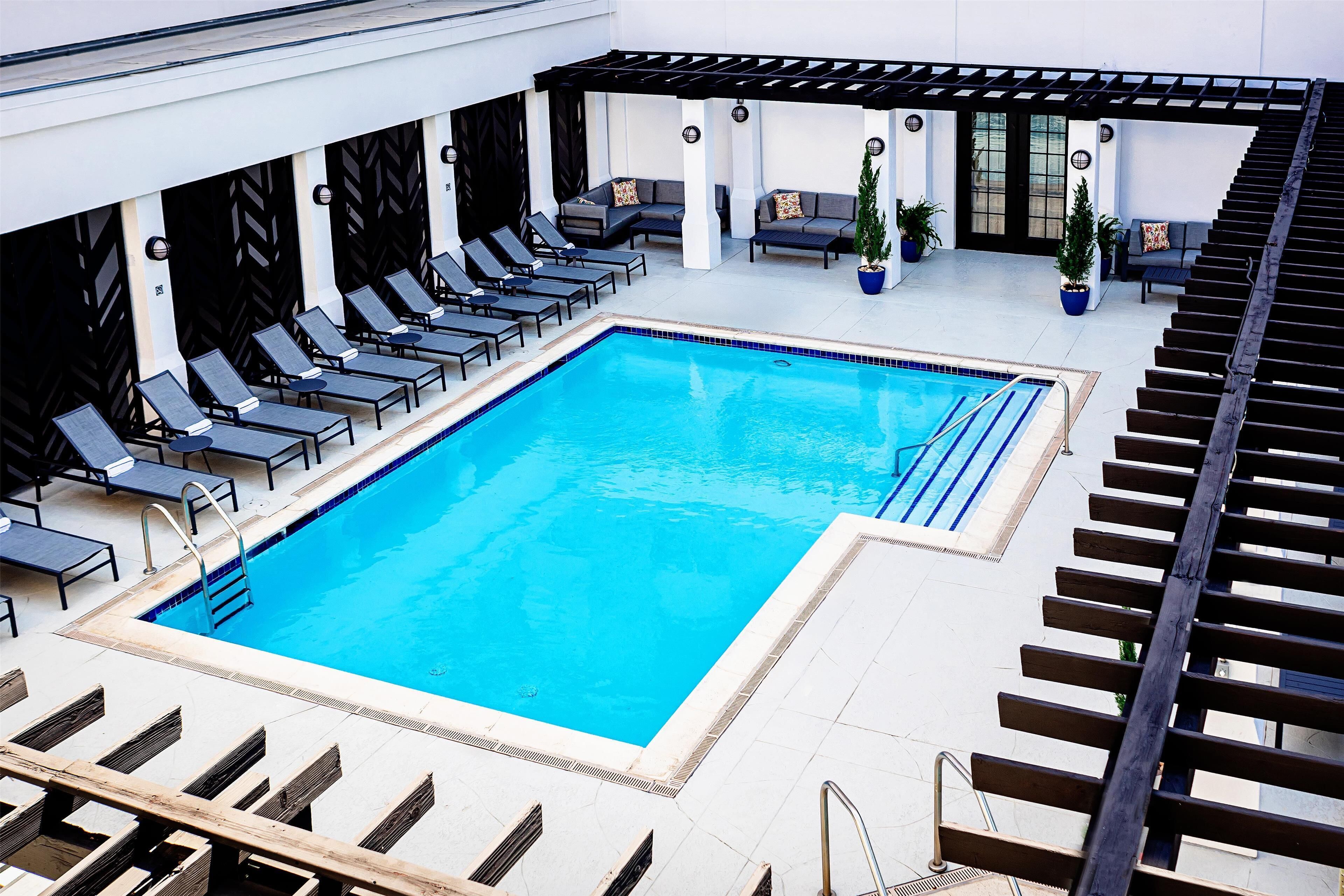 Outdoor pool, open 10:00 AM to 10:00 PM, pool loungers