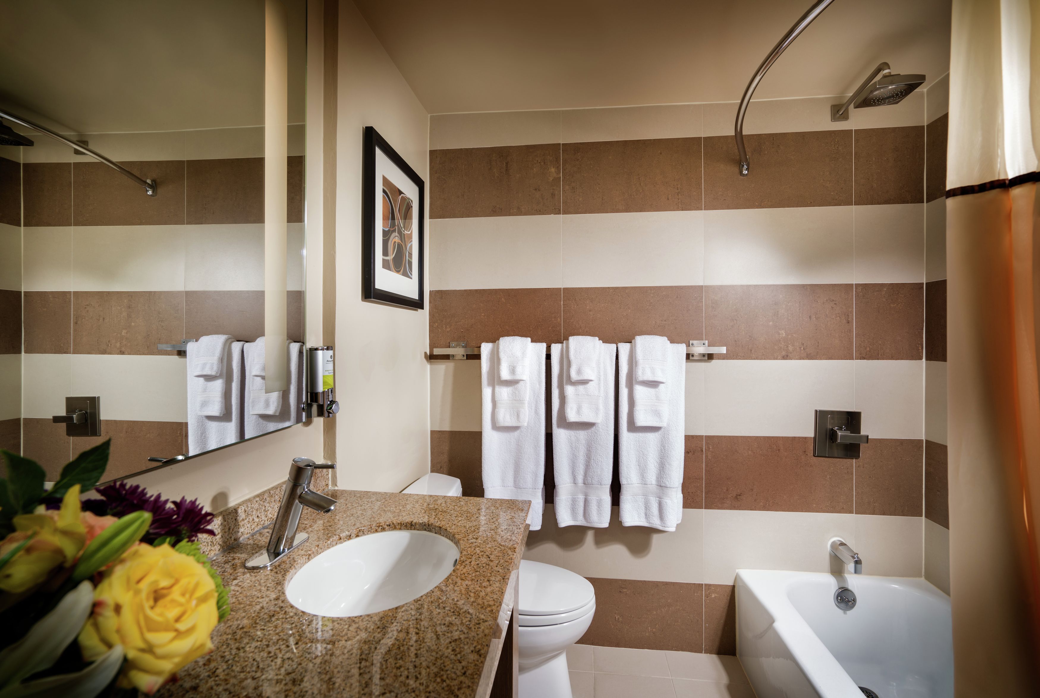 designer toiletries, hair dryer, bathrobes, towels