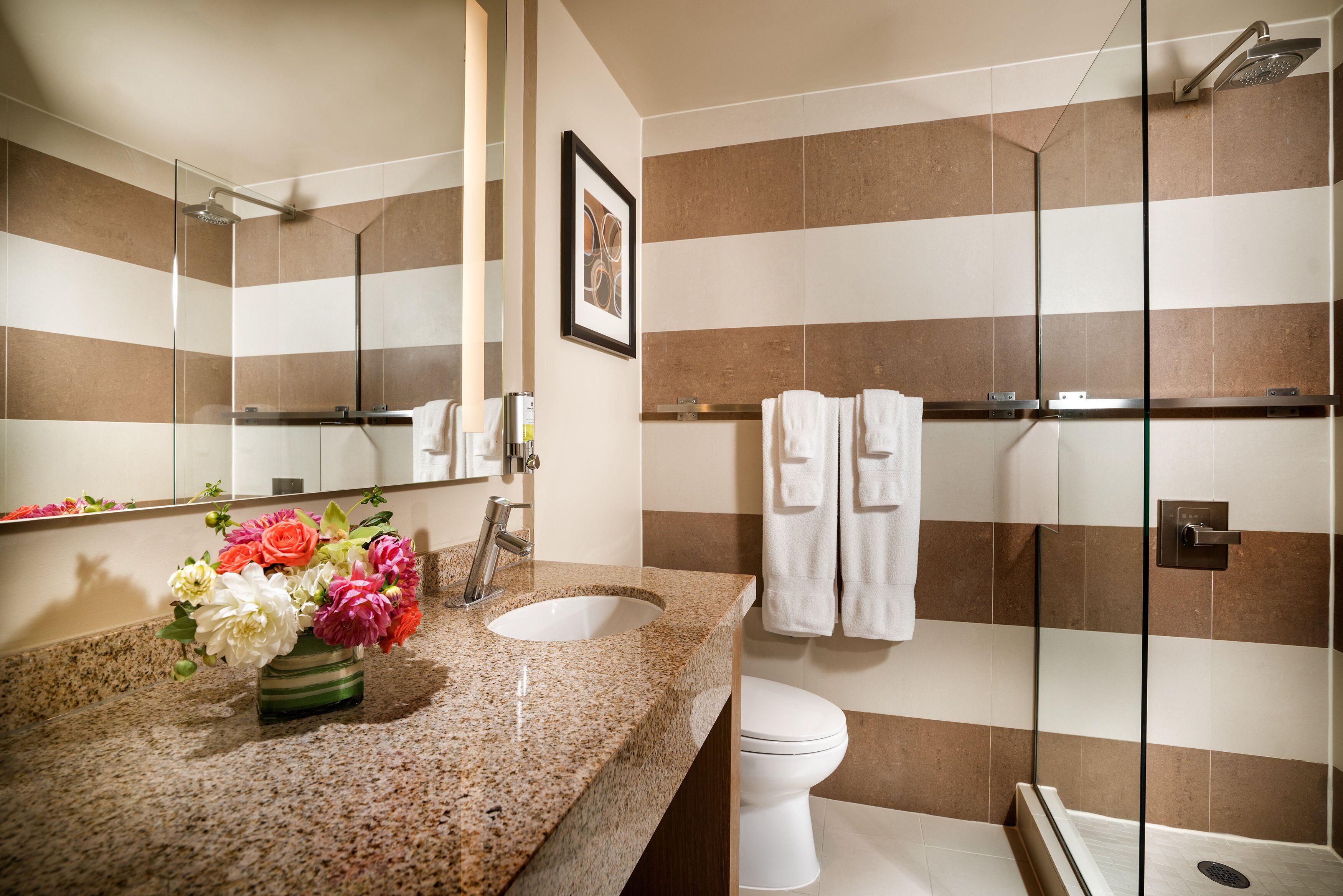 designer toiletries, hair dryer, bathrobes, towels