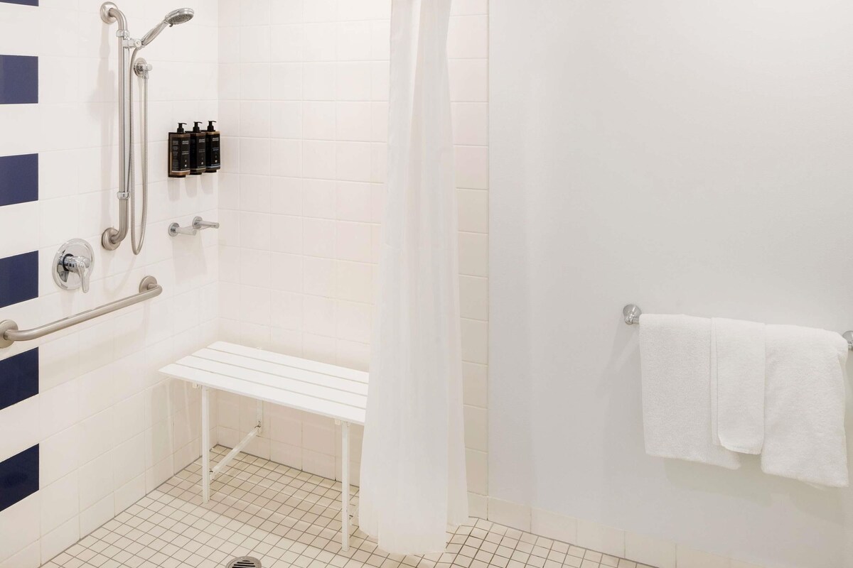 Shower, eco-friendly toiletries, hair dryer, towels