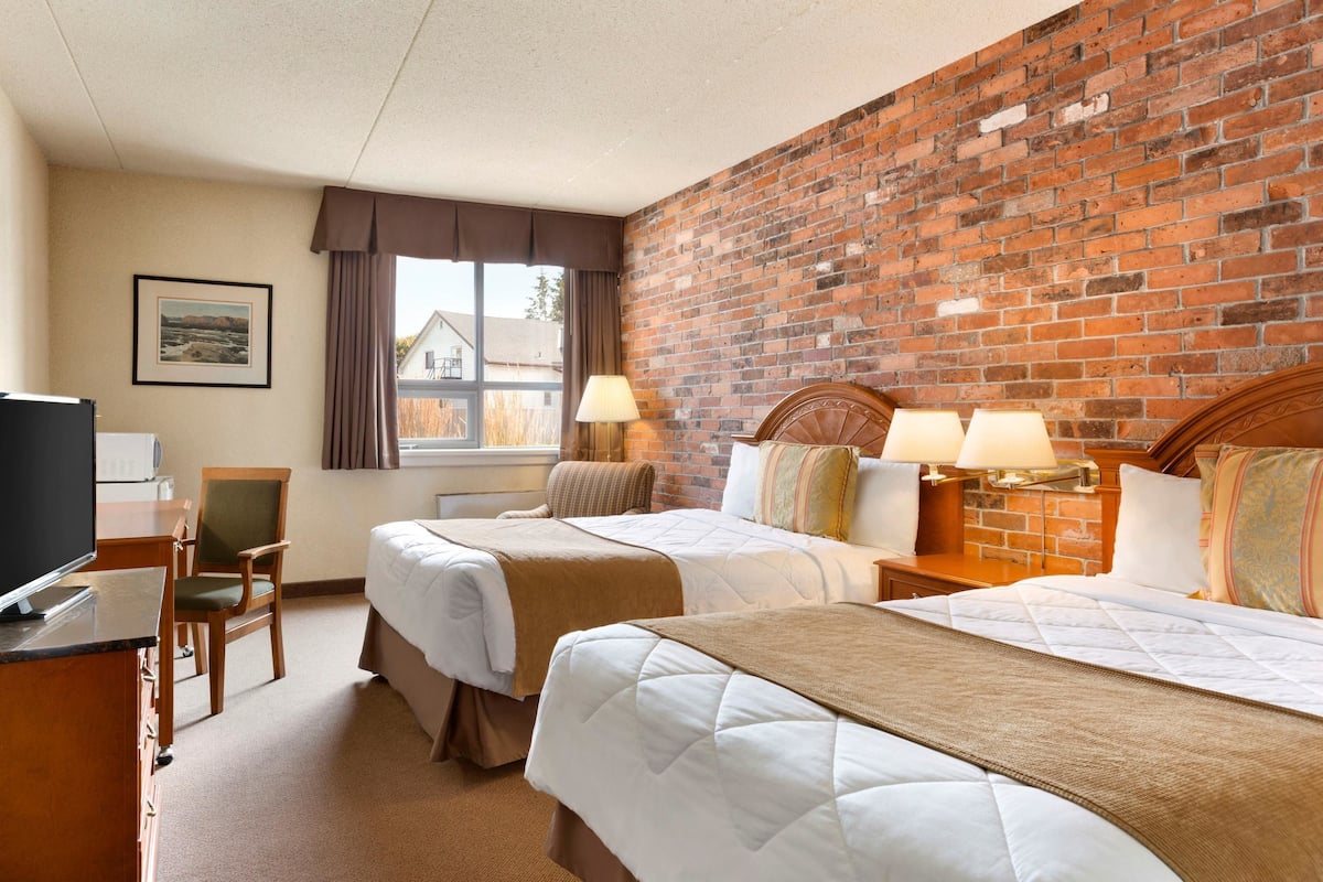 Premium bedding, pillow-top beds, blackout curtains, iron/ironing board