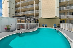 Seasonal outdoor pool, open 10:00 AM to 10:00 PM, pool loungers