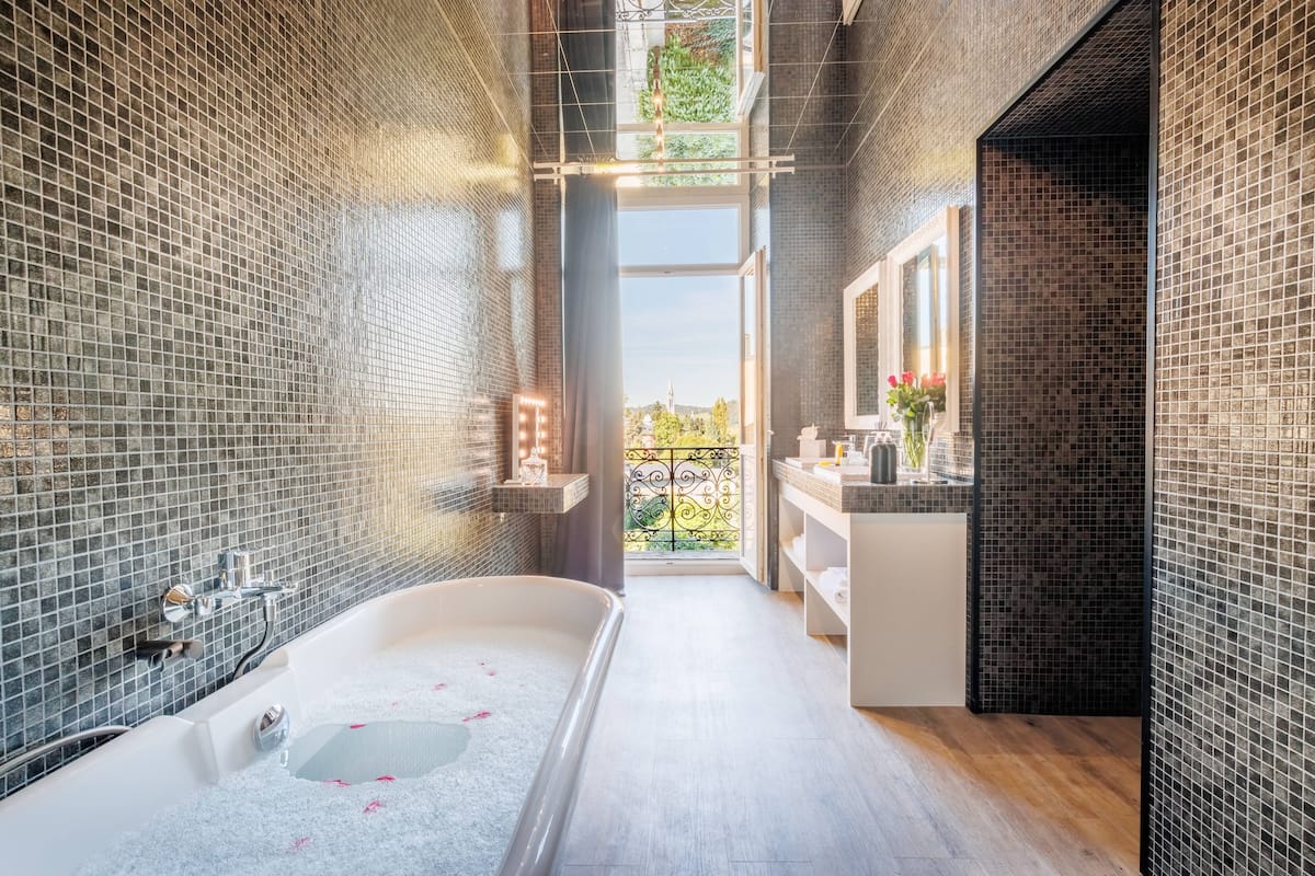 junior suite, river view | bathroom | designer toiletries, hair dryer, bathrobes, slippers