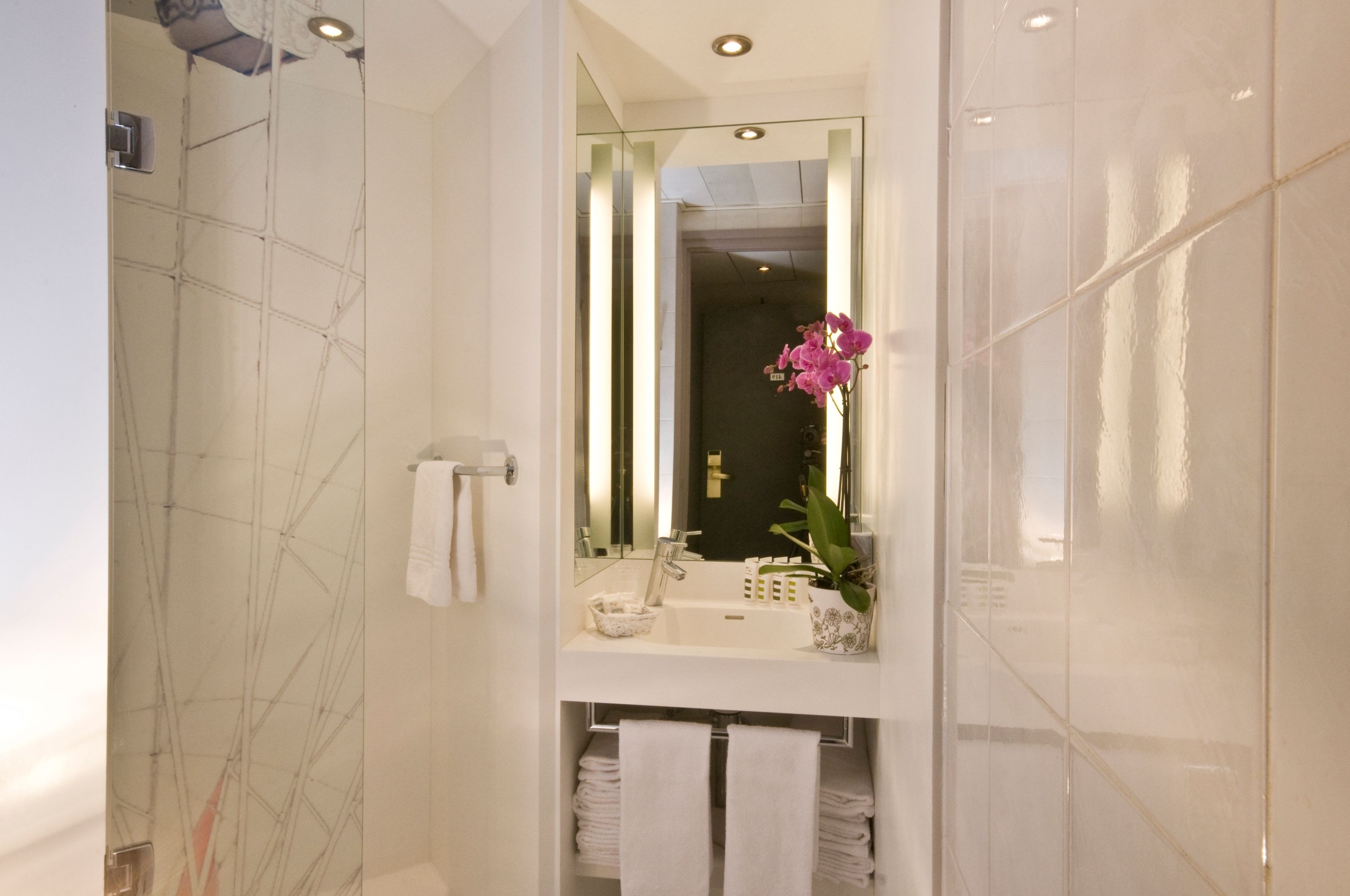 rainfall showerhead, eco-friendly toiletries, hair dryer, towels