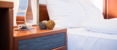 Hypo-allergenic bedding, desk, laptop workspace, blackout drapes