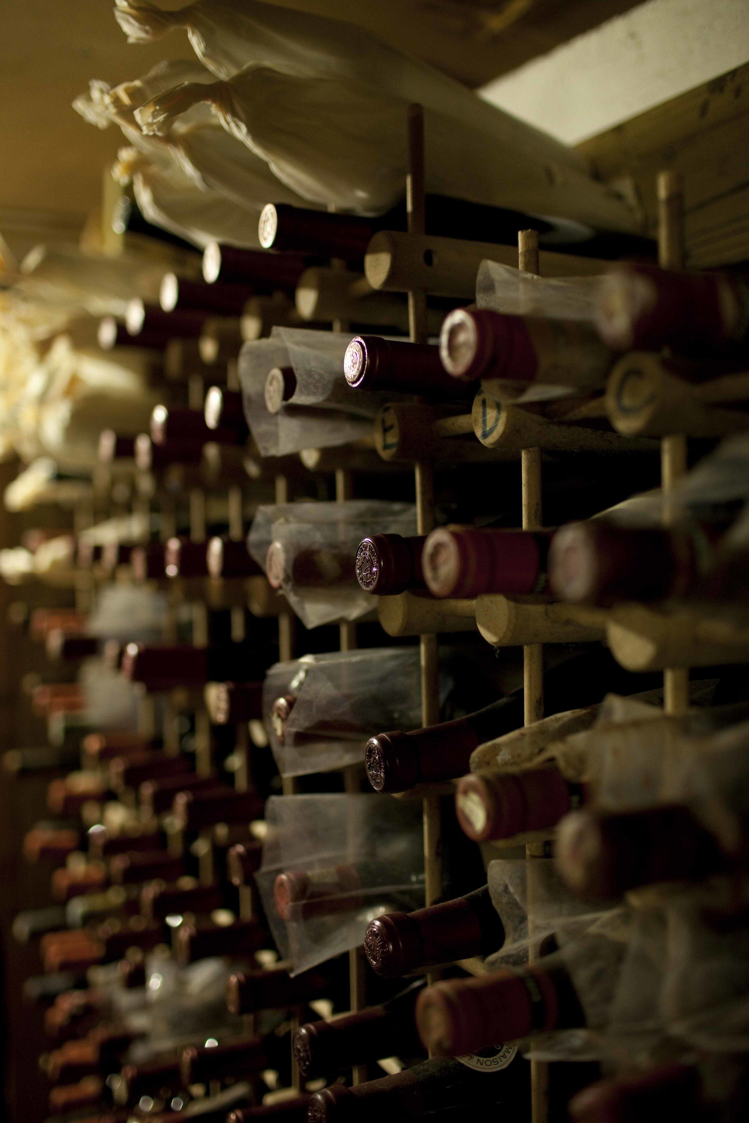 A wine rack with bottles.