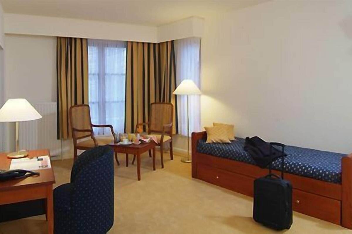 Triple Room | Minibar, in-room safe, individually furnished, desk