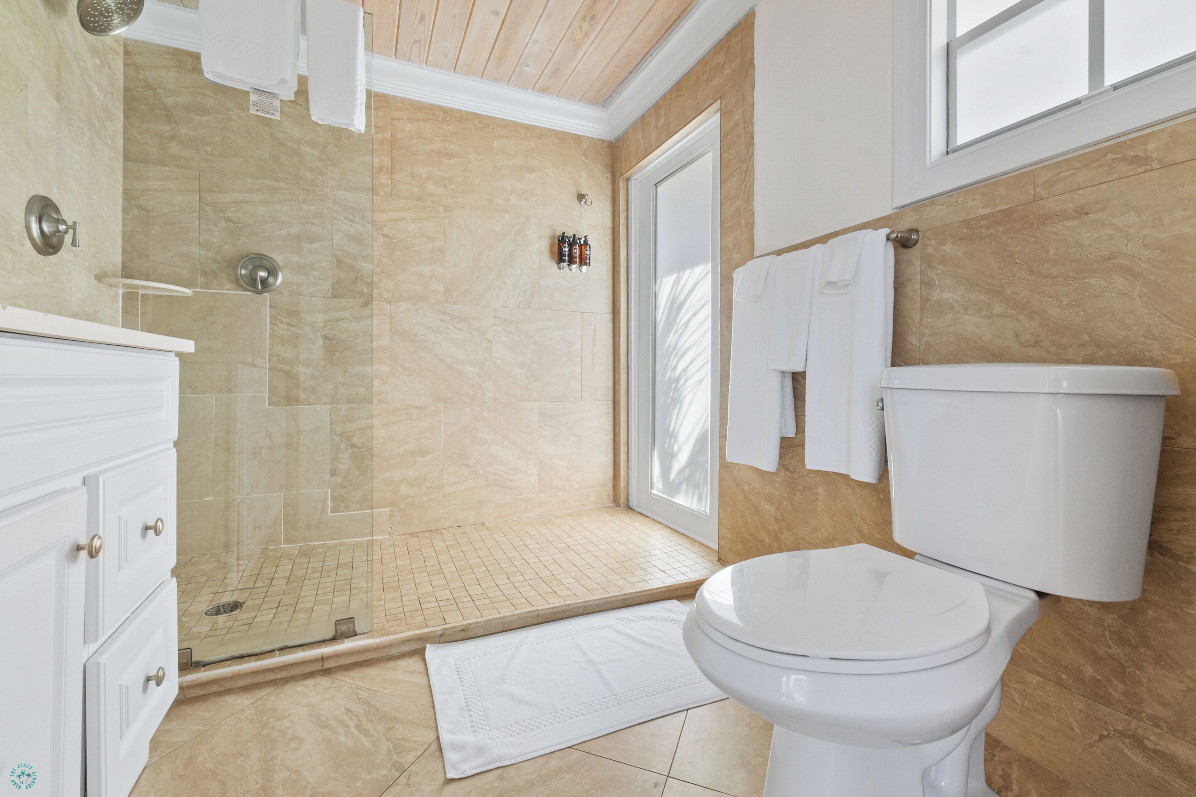 designer toiletries, hair dryer, towels