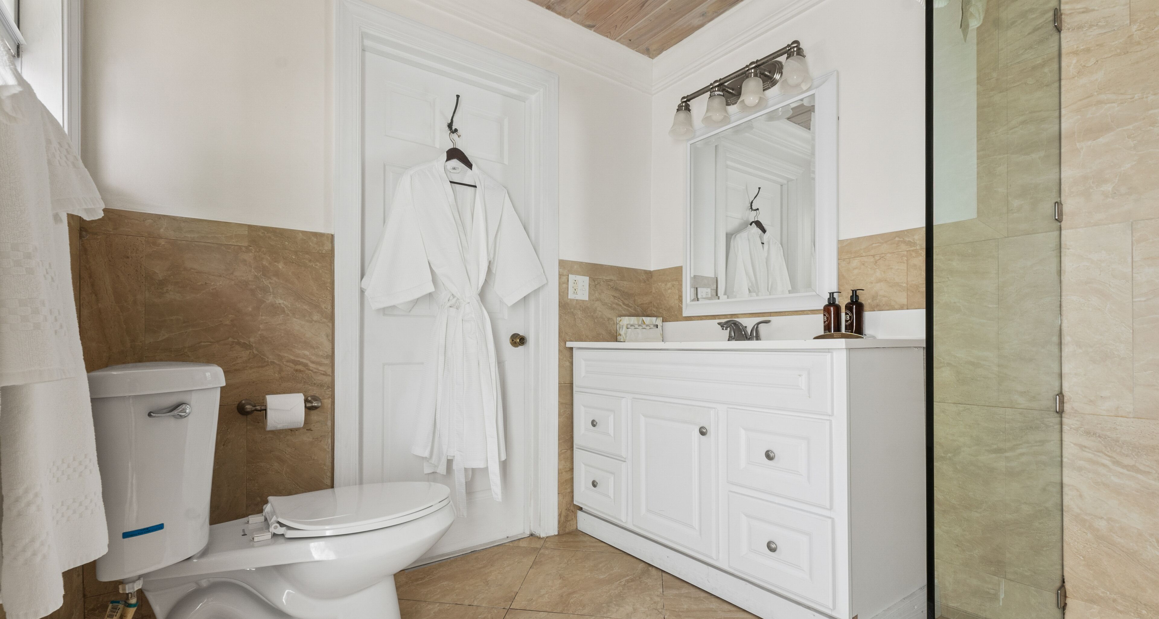 designer toiletries, hair dryer, towels