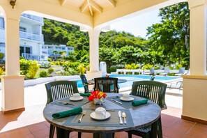 Breakfast, lunch served; local and international cuisine, pool views